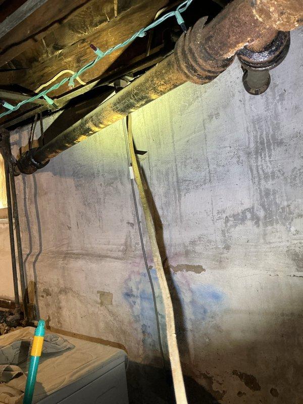 Responded to drain backup affecting bathroom shower and kitchen sink. Upon arrival, accessed basement plumbing system to locate source of stoppage. Identified blockage in main drain line causing wastewater to back up into fixtures. Successfully cleared obstruction using appropriate drain cleaning equipment, restoring proper drainage flow to both affected fixtures. Tested system operation to confirm complete resolution. Documented existing basement conditions including aging plumbing infrastructure and moisture concerns for homeowner awareness. Completed wrap-up communication as requested.