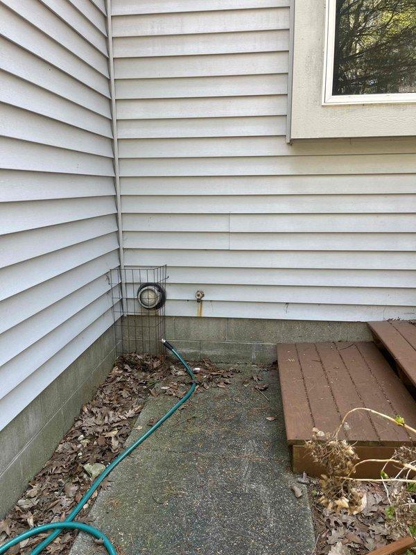 Responded to urgent safety concern regarding gas water heater with improper venting system causing carbon monoxide infiltration into basement area. Gas utility company identified that sidewall vent configuration was incorrectly installed, allowing combustion gases to re-enter living space rather than properly exhausting to exterior, resulting in elevated carbon monoxide levels during water heater operation. Conducted comprehensive assessment of existing water heater installation, photographed current venting configuration and equipment condition, and provided detailed estimate for complete water heater replacement with code-compliant vertical venting system to eliminate dangerous carbon monoxide hazard and ensure safe operation.