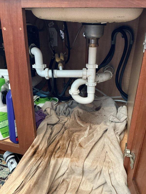Returned to property with drain machine to clear kitchen sink clog as quoted. Successfully cleared obstruction from kitchen drain line using mechanical cable auger. Tested drainage system with running water to verify proper flow and confirm complete clearance of blockage.