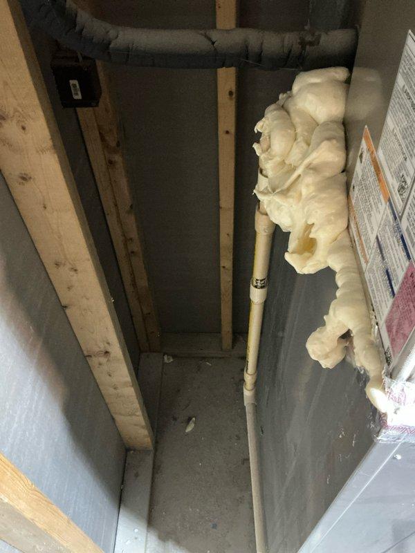 Conducted comprehensive estimate for replacement of original 1991 ICP furnace and undersized air conditioning system in residential property. Upon inspection of existing equipment in basement utility area, confirmed furnace has reached end of serviceable life at 33 years old and requires replacement to prevent imminent failure. Evaluated current HVAC infrastructure including ductwork configuration, existing water heater placement, and available space for new equipment installation. Documented undersized AC unit inadequate for proper cooling capacity and recommended appropriately sized replacement system. Photographed existing mechanical room layout, furnace cabinet with specifications, connected ductwork, and surrounding utility connections to facilitate accurate equipment sizing and installation planning for complete furnace and air conditioning system replacement.