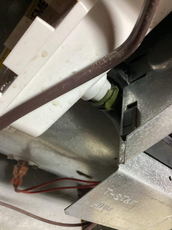 Completed annual cooling maintenance on 24-year-old Bryant AC system with 2023 condenser motor replacement. Performed comprehensive tune-up inspection revealing significant corrosion on refrigerant lines and evidence of moisture accumulation within the unit. Documented system condition with photos showing deteriorated copper piping with heavy rust buildup and condensation residue, as well as internal components including evaporator coil connections, refrigerant lines, and electrical wiring. System is operational but showing age-related wear requiring monitoring for potential future repairs.