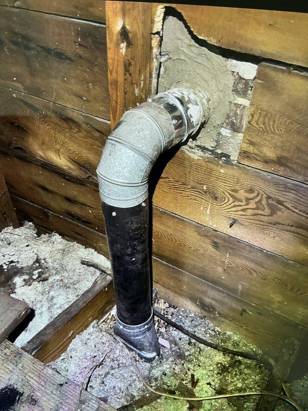 # No Heat Service Call

Responded to a no heat complaint on a 70-year-old furnace system. Upon arrival, conducted a comprehensive system inspection to diagnose the heating failure. Investigation revealed significant issues with the existing ductwork and venting system in the attic/crawl space area.

Found deteriorated and improperly configured ductwork, including damaged flexible duct sections and compromised PVC venting components. The metal vent opening showed signs of age-related deterioration with visible residue buildup affecting proper airflow. The existing duct connections were loose and separated, preventing adequate heated air distribution throughout the home.

The combustion venting system displayed concerning conditions, with the PVC exhaust pipe showing dust accumulation and potential air leakage at connection points. The metal coupling at the transition joint required attention due to improper sealing. Wooden structural components surrounding the vent penetrations showed m