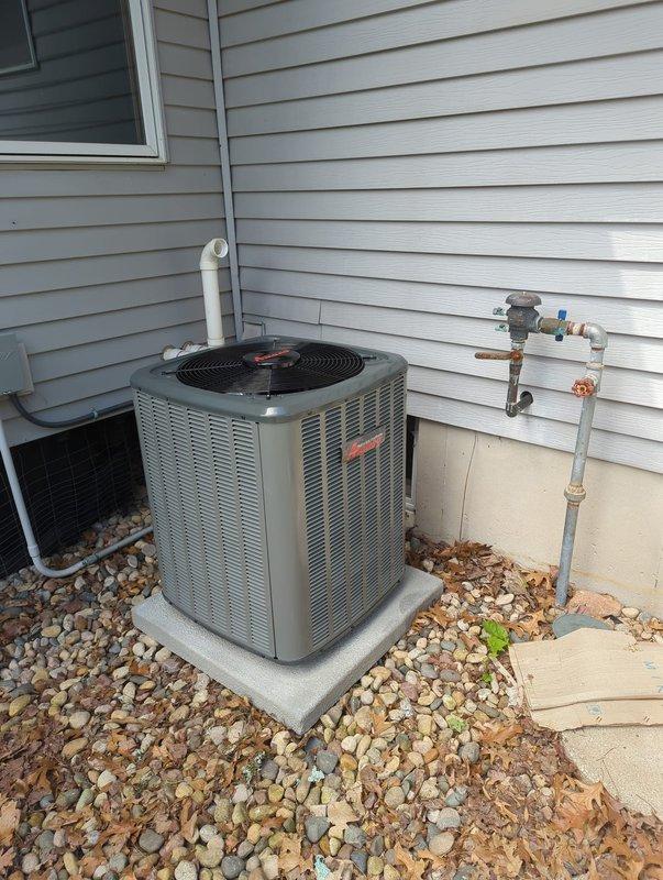 Completed full air conditioning system installation at residential property. Installed new outdoor condensing unit on concrete pad with proper refrigerant line set connections, electrical hookup, and PVC condensate drainage. System was charged with A2L refrigerant to manufacturer specifications (546 oz factory charge, 84 oz total charge), pressure tested, and verified for proper operation.