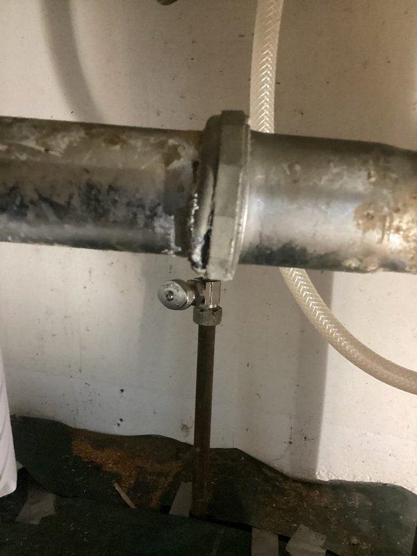 # Kitchen Sink Leak Repair

Responded to intermittent water leak under kitchen sink in century-old home. Upon inspection, discovered deteriorated PVC P-trap assembly with significant age-related degradation, including discoloration, staining, and compromised seals at slip joint connections beneath garbage disposal. White PVC drain components showed extensive wear patterns and brown staining concentrated around connection points, indicating long-term water seepage. 

Identified failing compression rings and worn slip joint gaskets as primary leak sources. P-trap configuration exhibited loose fittings and degraded washers allowing water to escape during drainage cycles, explaining the intermittent nature of the leak. Braided supply lines and shutoff valves inspected and found to be functioning properly with no evidence of supply-side leakage.

Disassembled existing P-trap assembly and removed all deteriorated components. Cleaned mounting surfaces and disposal tailpiece to ensure proper s