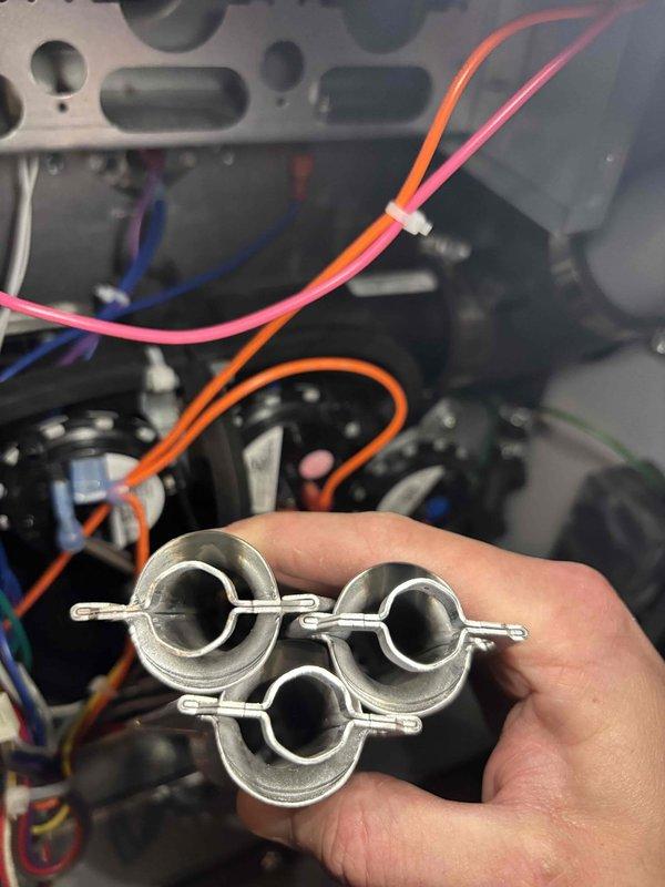 # HVAC System Repair - No Heat Condition

Responded to service call for gas furnace running without producing heat. Upon arrival, performed diagnostic inspection of heating system and internal components.

Opened service panel and accessed internal wiring and control systems. Identified failed or damaged ring terminal connectors on critical electrical connections. These terminals showed signs of deterioration that prevented proper electrical continuity to heating components.

Removed three defective ring terminals from the system wiring. Replaced failed connectors with new ring terminals to restore proper electrical connections. Verified all wire connections were secure and properly seated.

Tested system operation after repairs. Confirmed furnace ignition sequence initiated properly and heating cycle engaged as designed. Verified heat output at supply registers. System restored to full operational status.