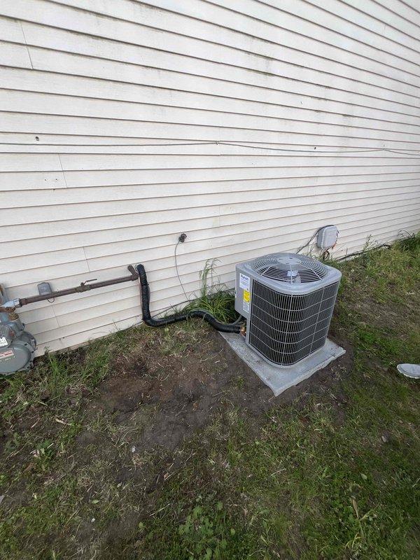Completed full HVAC system replacement including outdoor condensing unit and indoor furnace. Installed new cylindrical condenser on existing concrete pad with proper clearances from gas meter and building structure. Ran refrigerant lines with appropriate insulation from outdoor unit through wall penetration to indoor air handler. Installed furnace in utility area with copper refrigerant lines, PVC condensate drainage system, and proper electrical connections. Verified all connections, tested system operation, and confirmed proper drainage flow.