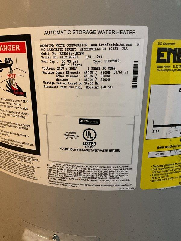 Responded to complaint of insufficient hot water and rapid depletion after recent thermostat installation. Inspected Bradford White RE350S6-1NCWM 50-gallon electric water heater. Documented unit specifications showing 240V/208V operation with dual 4500W/3500W heating elements. Examined upper thermostat installation and wiring connections in control compartment. Verified proper wire terminations including black, green ground, and red power wires secured to thermostat assembly. Noted visible corrosion and rust staining in control compartment indicating age-related deterioration and potential moisture exposure. Photographed unit nameplate data and internal thermostat configuration for service records.