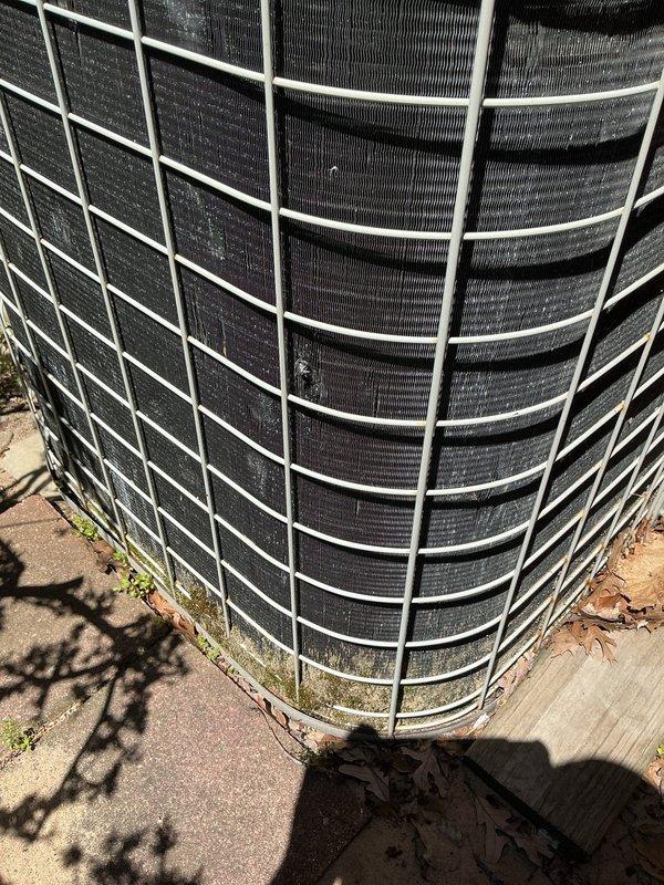 Completed ASTU-AC Super Tune-up on 16-year-old AirQuest outdoor condensing unit. Performed comprehensive system inspection, straightened bent condenser fins to restore proper airflow, and cleaned heavily soiled coil surfaces which showed significant dirt and debris accumulation. Verified unit operational performance and provided consultation regarding mini-split installation options for garage heating application.