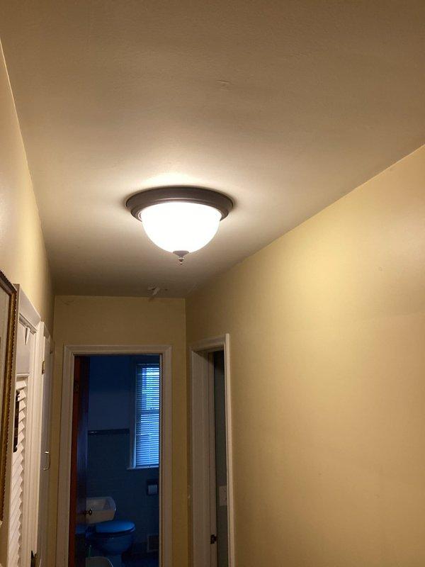 Completed quoted repairs throughout residential property excluding hallway lighting fixtures. Verified proper operation of bathroom exhaust fan and ceiling-mounted light fixture in main hallway. All repaired fixtures tested and confirmed functioning correctly upon completion.