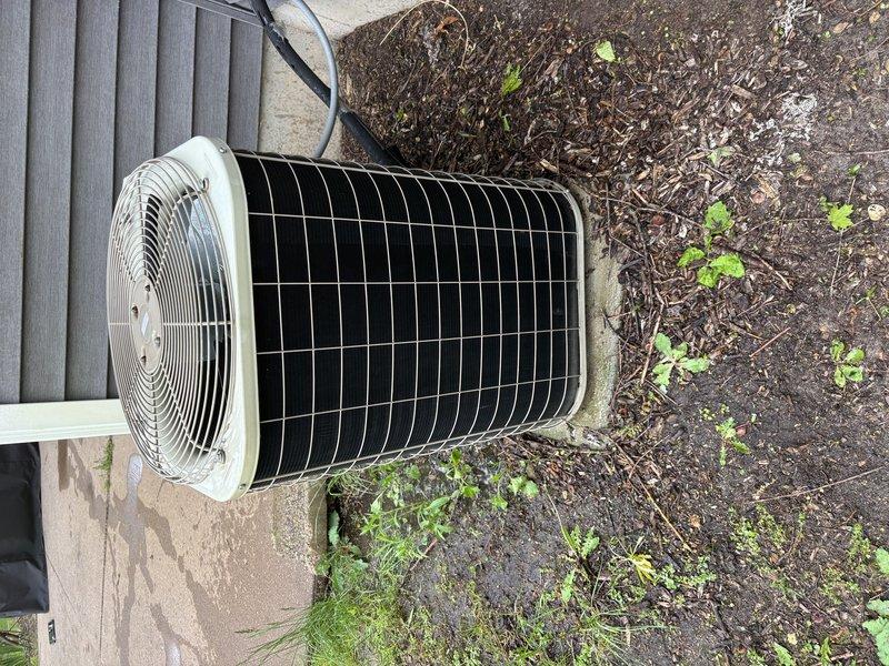 Completed annual cooling maintenance on 21-year-old Payne air conditioning system. Performed comprehensive tune-up including inspection of condenser unit, verified fan operation and protective grille integrity, assessed heat exchanger coil condition, and documented equipment status with photographic records. Unit found in operational condition with coils clean and free of debris; no immediate repairs required at time of service.