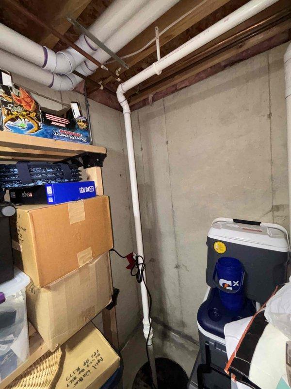 Arrived early as requested to evaluate basement for backup sump pump installation. Inspected existing sump pump system, including primary pump assembly with discharge piping and current configuration. Assessed utility area layout, noting available space near concrete block foundation wall and existing PVC drainage lines. Documented current setup with photos showing pump basin, mechanical components, and potential installation locations for backup system. Provided estimate for new backup sump pump installation to customer. Completed walkthrough of work area.