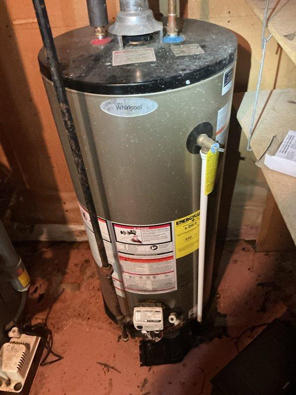 Responded to no hot water call at residential property. Upon arrival, inspected Whirlpool water heater unit located in basement utility area. Evaluated all plumbing connections, temperature and pressure relief valve, gas supply lines, and electrical components. Checked thermostat settings and pilot light operation. Verified proper venting configuration and examined copper supply lines with shut-off valves for any leaks or obstructions. Assessed integrated HVAC system including furnace, expansion tank, and ductwork to ensure no interference with water heater operation. Restored hot water functionality to residence and confirmed system operating within normal parameters before departure.