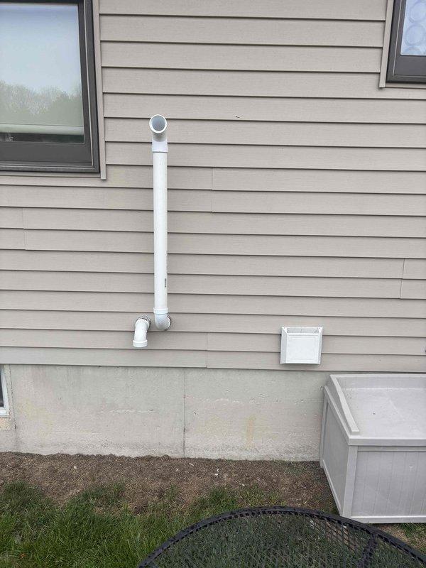Responded to inspection correction notice regarding improperly configured furnace venting system. The air intake and exhaust terminations were found to be reversed and positioned too close to the fresh air intake, creating a potential safety hazard and code violation. Corrected the PVC vent pipe configuration by properly routing and repositioning the intake and exhaust terminations to meet manufacturer specifications and local building code requirements for proper clearance distances. Verified adequate separation between combustion air exhaust and fresh air intake to prevent recirculation of flue gases into the system.