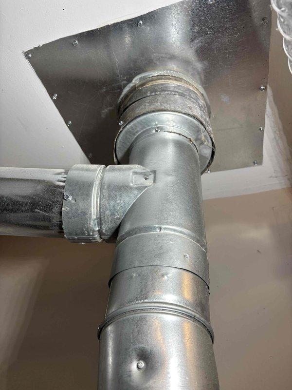 Provided estimate for replacement of existing 2004 Hotpoint water heater that has reached end of serviceable life at 21 years old. Evaluated current installation location and confirmed property is site-built construction, not mobile or manufactured home. Documented existing HVAC system configuration including Payne furnace installation and ductwork routing for reference during future water heater replacement to ensure proper clearances and access are maintained.