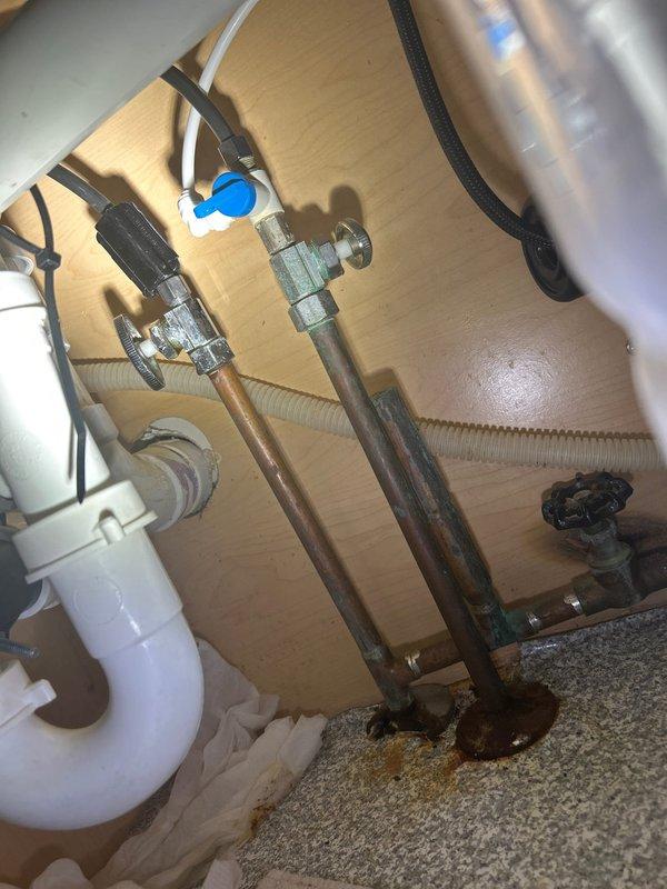 Responded to emergency plumbing leak at kitchen sink. Upon arrival, identified active leak at shut-off valve union connection under sink. Shut off water supply, removed faulty union fitting, cleaned threads, and installed new compression union with proper sealing. Tested system under full pressure to confirm leak was eliminated. Inspected surrounding plumbing connections and water heater installation for additional issues. No further leaks detected upon completion.