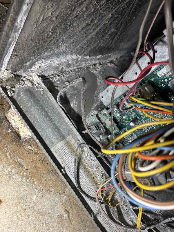 Completed annual cooling maintenance on 6-year-old EnergiAir system with warranty through March 2029. Performed comprehensive inspection of air handler unit, noting significant dust and debris accumulation on evaporator coil and interior surfaces. Documented extensive corrosion and deterioration on galvanized metal ductwork and plenum in attic space, indicating prolonged moisture exposure. Inspected control board and low-voltage wiring connections, verifying all electrical terminations secure. Captured photographic documentation of equipment condition including interior coil assembly and corroded ductwork for maintenance records.