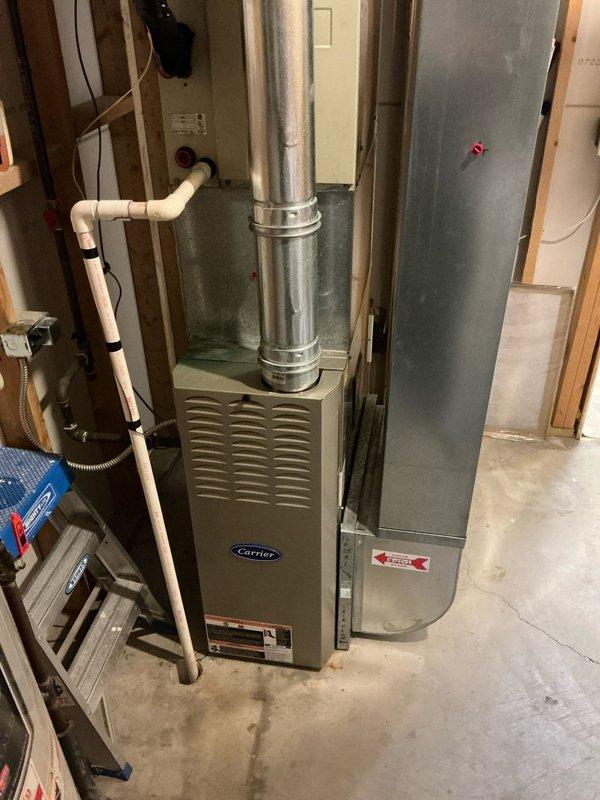 Completed furnace and water heater replacement estimate for residential property with existing Carrier furnace system installed in basement utility area. Evaluated current HVAC equipment condition, ductwork configuration, electrical panel capacity and circuit availability, PVC condensate drainage system, and existing infrastructure to provide comprehensive replacement options. Documented equipment specifications, installation requirements, and electrical service compatibility for proposed new furnace and water heater installations.