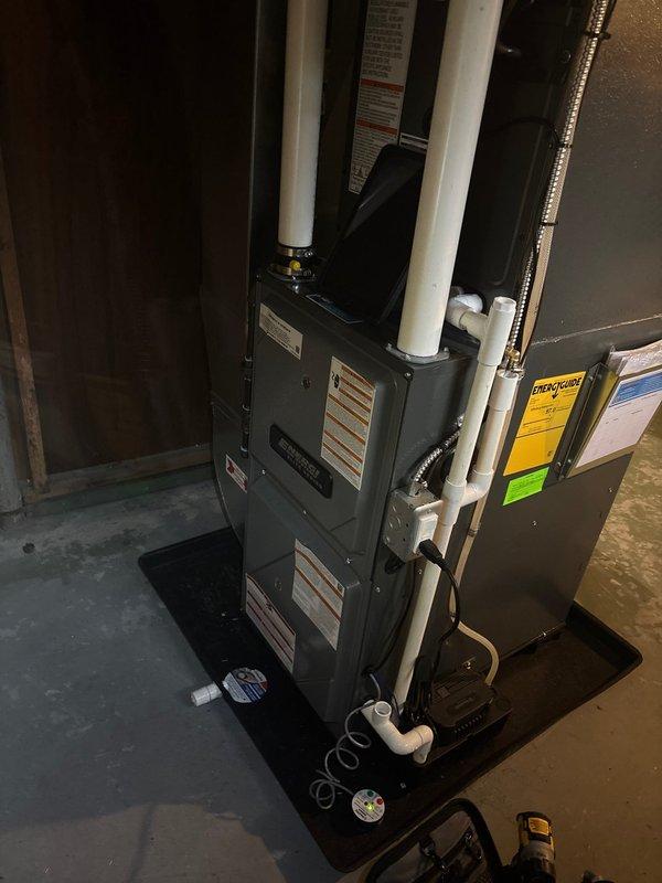 Completed annual cooling maintenance on Alumacoil heat pump system model CAPTA3022B3AA with A2L refrigerant. Performed comprehensive inspection of basement-installed unit including furnace and air handler components, verified all electrical connections, checked refrigerant levels, inspected PVC intake/exhaust venting, and documented system specifications and equipment condition with photos.