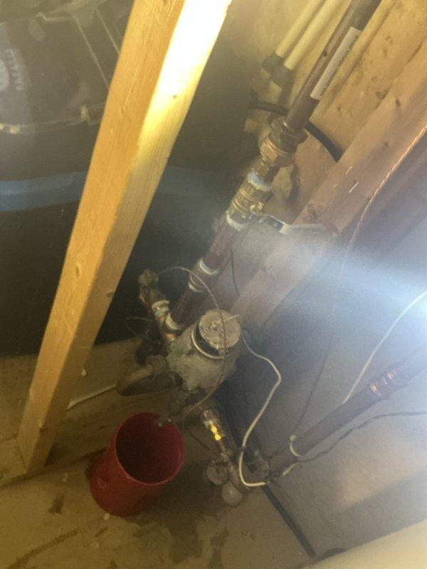 Completed installation of new gas meter piping in basement utility area. Replaced aging metal pipe assembly with updated components including new valves, fittings, and pressure regulation equipment. Work performed in accordance with local code requirements for residential gas service connections.