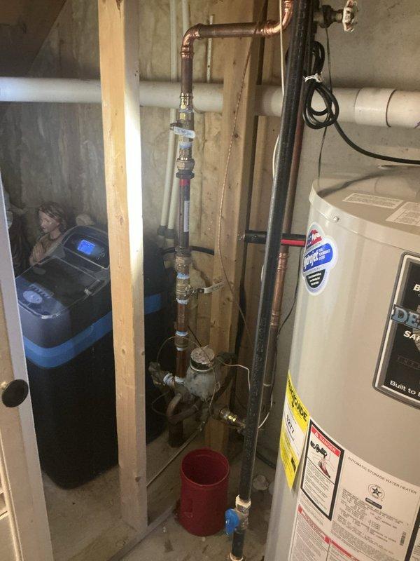 Completed installation of new gas meter piping in basement utility area. Replaced aging metal pipe assembly with updated components including new valves, fittings, and pressure regulation equipment. Work performed in accordance with local code requirements for residential gas service connections.