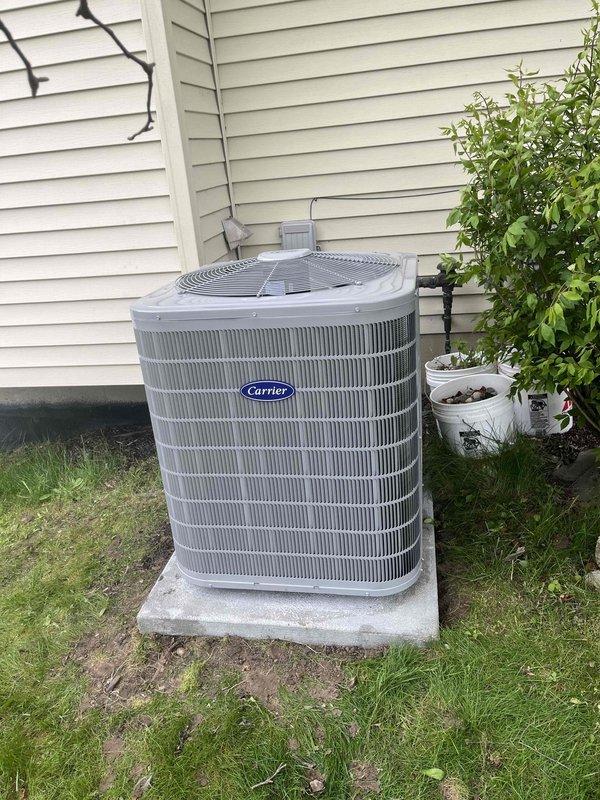 Completed full HVAC system replacement including installation of new Carrier air conditioning unit on exterior concrete pad with proper refrigerant line routing and securing to building exterior, and new furnace/air handler installation in attic space with metallic ductwork connections and proper insulation clearances. All equipment positioned per manufacturer specifications with secure mounting, appropriate electrical connections, and condensate drainage provisions. System tested and operational upon completion.