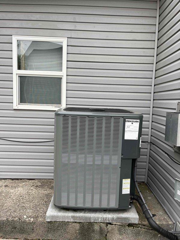 Completed annual cooling maintenance and tune-up on residential EnergiAir air conditioning system under active warranty coverage. Performed comprehensive inspection of outdoor condensing unit and indoor air handler components, verified proper drainage from condensate pan, checked electrical connections and disconnect box functionality, and documented equipment condition through photographic records. All system components found operating within normal parameters with no immediate service needs identified.