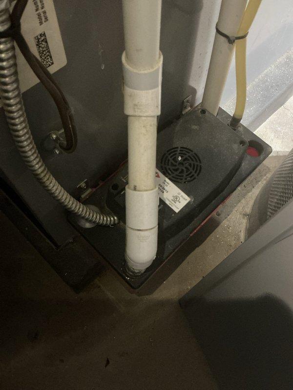Completed annual cooling maintenance on 24-year-old ICP system. Inspected indoor unit including condensate drain pan, PVC drainage lines, and electrical connections; verified proper drainage function and cleared debris from outdoor unit base and surrounding area. All components operating within normal parameters; system ready for cooling season.