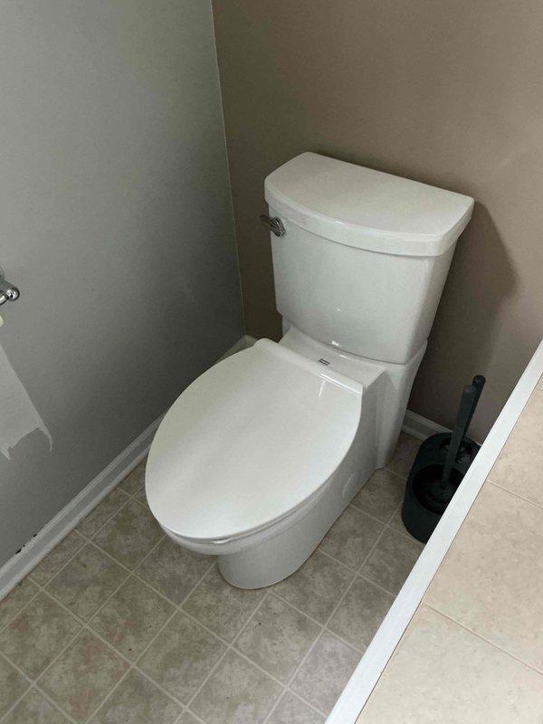 Completed installation of customer-supplied toilet and two angle stops in bathroom. Installed new fixtures with braided stainless steel supply line, ensuring proper connections and seal integrity. All components tested and verified operational with no leaks detected.