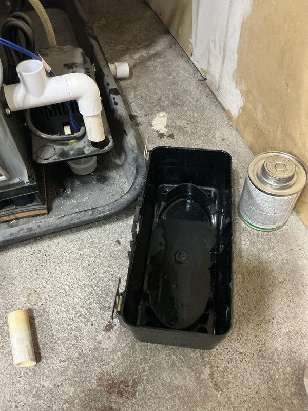 Completed annual cooling maintenance on AC system. Performed comprehensive tune-up inspection including checking refrigerant levels, electrical connections, and condensate drainage system. Inspected outdoor unit and confirmed no manufacturer's label cover exists for this model as these components are not standard equipment for this unit type. Photographed condensate pump assembly and drainage pan showing normal operational condition with minor debris accumulation around base. All systems tested and operating within manufacturer specifications.