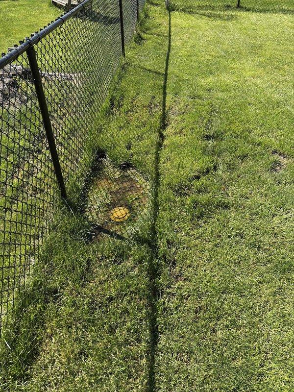 Responded to service call for sump pump not draining properly following previous repair work. Upon arrival, conducted thorough inspection of the sump pump system and discharge line. Identified issue with exterior discharge point near property fence line where water was not flowing correctly. Cleared obstruction in discharge line and verified proper drainage away from foundation. Tested sump pump operation through multiple cycles to confirm water is now draining effectively through the exterior discharge point along fence perimeter. System restored to full working condition with proper water evacuation confirmed.