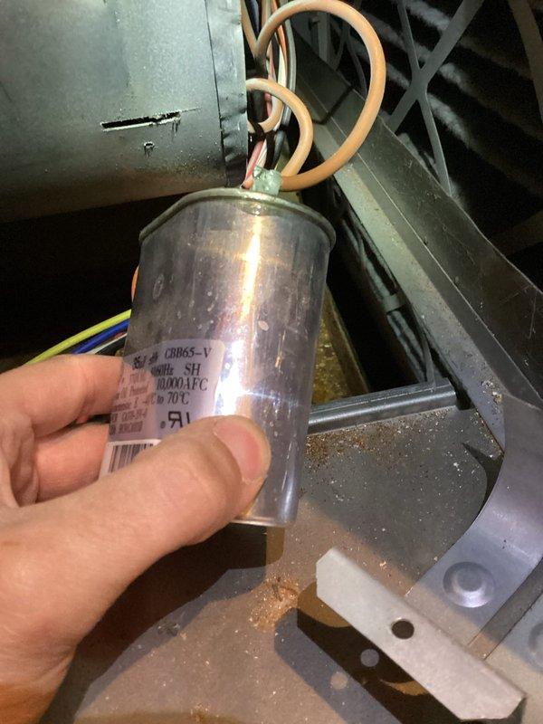 Completed annual cooling maintenance on 8-year-old Rheem system. Performed comprehensive inspection of outdoor condenser unit, including examination of refrigerant lines showing weathering and environmental exposure. Inspected and tested capacitor, noting accumulated dust and debris within electrical compartment. Cleaned components, verified proper connections on copper wire terminals, and ensured all mechanical systems operating within manufacturer specifications for continued reliable performance through the cooling season.