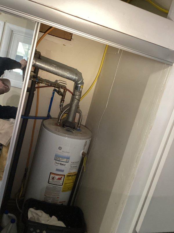 Conducted on-site assessment for garbage disposal installation project. Evaluated existing under-sink plumbing configuration and electrical requirements for disposal unit with dedicated wall switch connection. Documented mechanical room utilities and water heater setup to determine optimal routing for disposal drain line and electrical circuit installation.