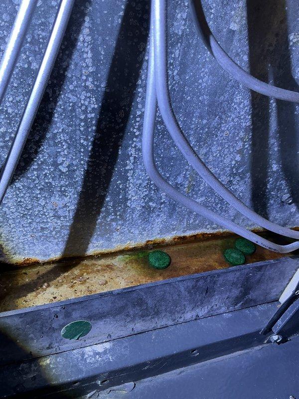 Completed annual cooling maintenance on residential AC system. Upon inspection, discovered extensive frost and ice buildup on evaporator coil and refrigerant lines, indicating restricted airflow or low refrigerant charge. Found heavily soiled return air vent grille with significant dust and debris accumulation. Addressed airflow restriction issues, cleared drain pan containing discolored condensate, and performed standard tune-up procedures including filter evaluation and system performance verification. Renewed maintenance agreement covering furnace, air conditioner, and humidifier equipment.