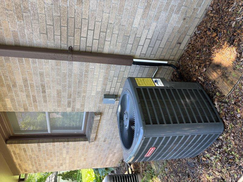 Completed quoted repair on Goodman brand air conditioning condenser unit located on exterior concrete pad. Performed first-time AC system visit and executed quick repair as specified in quote, with all work documented through on-site photography showing unit positioning, electrical conduit routing, and condensate drain line configuration.