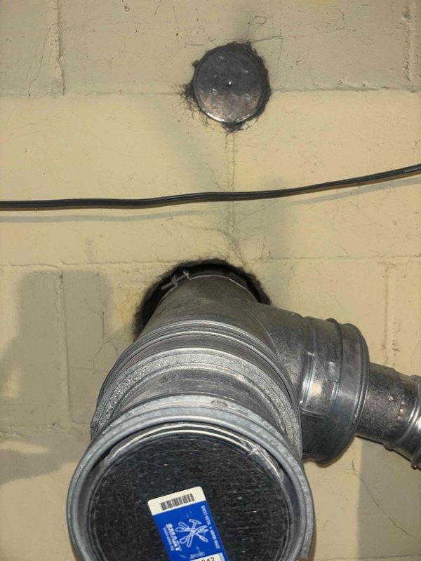 Provided estimate for replacement of existing 40-gallon natural gas water heater in single family residence. Unit located in basement utility area with existing copper supply lines, brass shut-off valves, and proper venting infrastructure already in place. Documented current installation including water heater positioning, plumbing connections, and surrounding mechanical systems for accurate replacement specifications.