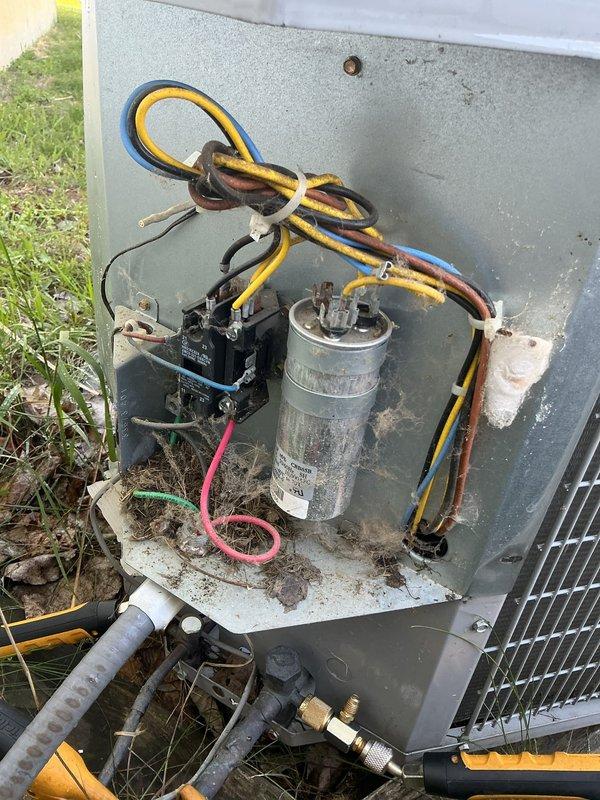 Completed annual cooling maintenance on a 9-year-old residential air conditioning system. Performed comprehensive inspection of outdoor condenser unit, including visual assessment of cabinet condition, fan assembly, and refrigerant line connections. Accessed electrical compartment and inspected contactor, capacitor, and all electrical connections for proper operation and signs of wear. Noted normal weathering and dirt accumulation consistent with outdoor equipment age. Documented unit condition with photographs showing external components, electrical panel, and mechanical connections. System operational and ready for cooling season.