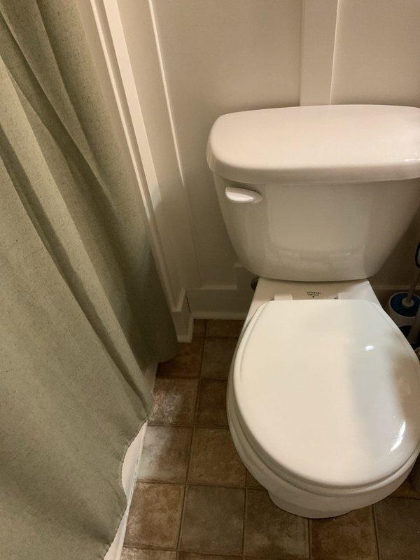 Responded to customer complaint of intermittent sewer odor in basement and leaking shower head. Upon inspection, identified improper venting on sump pump system as source of sewer gas infiltration. Verified sump pump vent configuration and confirmed "VENT ONLY" labeling on vertical PVC discharge lines. Assessed all pipe connections, rubber couplings, and hose clamps for proper seal integrity. Inspected bathroom facilities including toilet and shower area to rule out additional plumbing issues contributing to odor problems. Recommended proper venting solutions to prevent negative pressure conditions that allow sewer gases to enter living space through plumbing fixtures and floor drains. Addressed shower head malfunction requiring repair or replacement to eliminate water spurting issue.