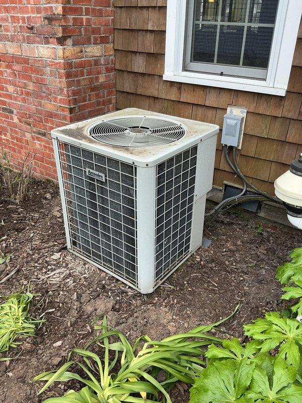 Completed annual cooling maintenance on 11-year-old Arco air conditioning system. Performed comprehensive tune-up including inspection of outdoor condenser unit and indoor evaporator coil, verified refrigerant levels on copper line set, checked electrical connections and disconnect box, and documented equipment condition with photos. Unit operating within normal parameters upon completion.