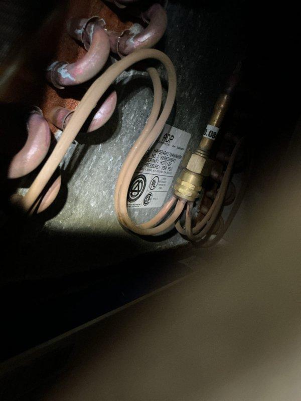 Completed annual cooling maintenance on 11-year-old Arco air conditioning system. Performed comprehensive tune-up including inspection of outdoor condenser unit and indoor evaporator coil, verified refrigerant levels on copper line set, checked electrical connections and disconnect box, and documented equipment condition with photos. Unit operating within normal parameters upon completion.