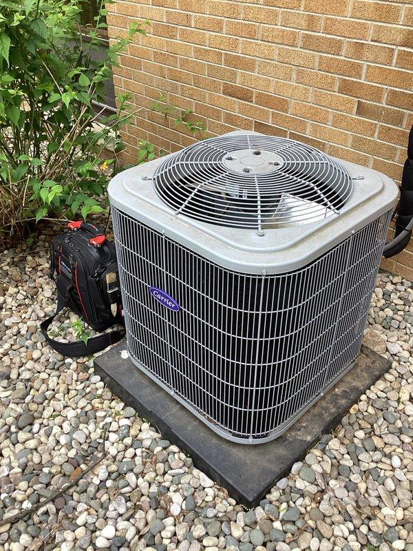 Completed annual cooling maintenance on 5-year-old Carrier system. Performed comprehensive inspection of outdoor condenser unit and indoor air handling equipment, checked refrigerant levels, cleaned condenser coils, verified electrical connections, tested system operation and airflow, and documented equipment condition with photos. All components found operating within manufacturer specifications with no issues identified.
