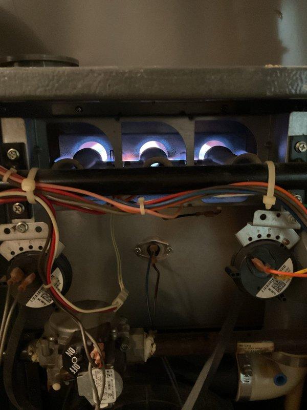 Completed comprehensive furnace super tune-up on 22-year-old Goodman gas furnace unit. Performed full system inspection, verified proper burner ignition with clean blue flame combustion across all three burner ports, tested all electrical connections and safety controls, inspected blower motor assembly and heat exchanger condition, and confirmed optimal system operation with no issues identified.