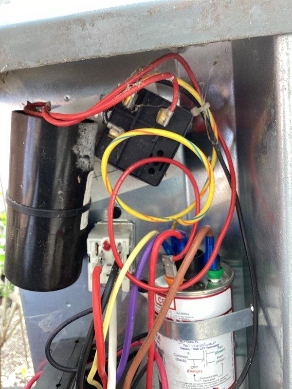 Completed annual AC tune-up on 13-year-old EnergiAir system (2016 condenser model). Inspected air handler unit and found drain pan with heavy mineral deposits, mold buildup, and corrosion requiring cleaning or replacement recommendation. Examined outdoor condenser unit electrical components, noting rust and weathering on enclosure with aged capacitor and loosely organized wiring connections. All refrigerant lines, electrical connections, and system operations checked and documented with photos for customer records.