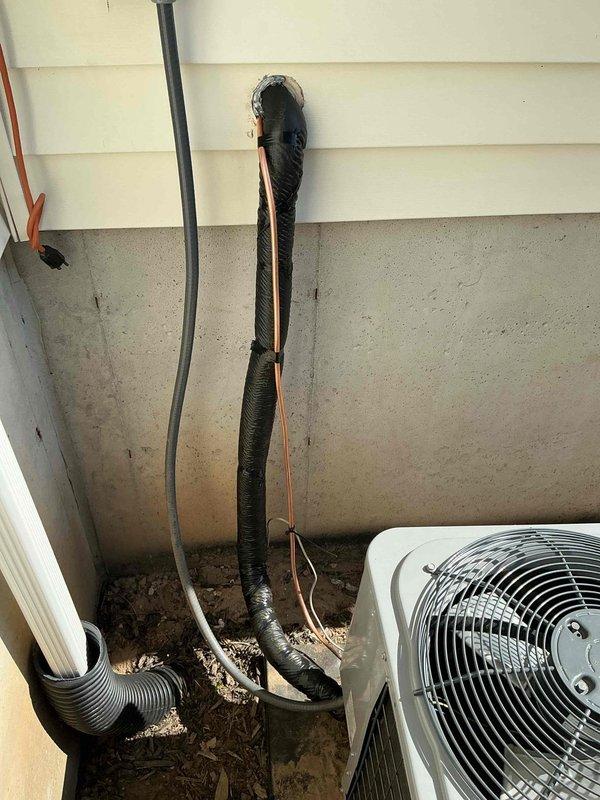 Replaced leaking refrigerant lineset on mini-split heat pump system, running new copper lines from outdoor condenser unit through building penetration to indoor air handler. Evacuated system, pressure tested for leaks, and recharged with proper refrigerant to manufacturer specifications.