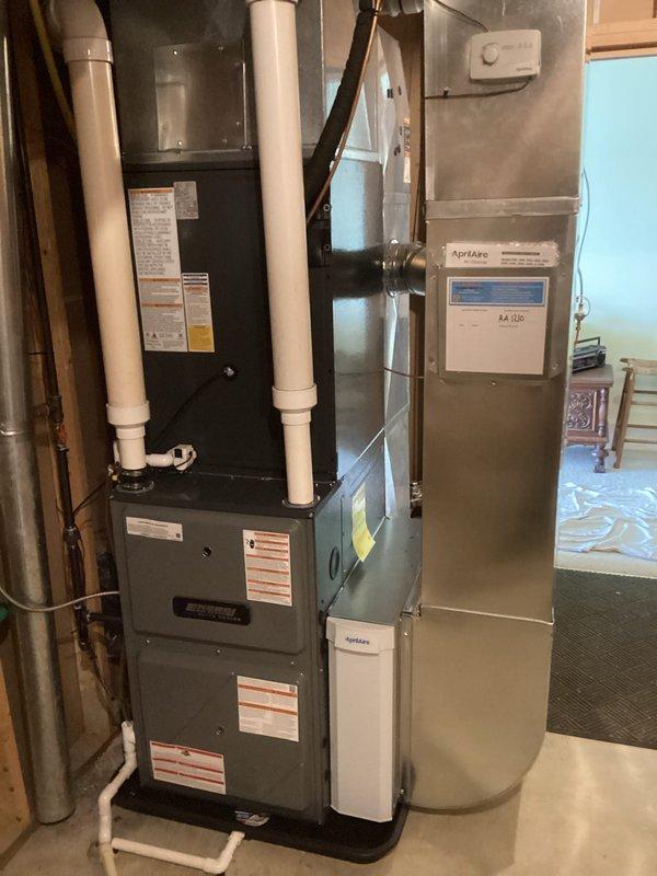 Completed full HVAC system installation including new furnace and air conditioning unit. Indoor equipment installed in basement mechanical room with proper PVC venting, condensate drainage, and AprilAire air handler integration. Outdoor condenser unit mounted on concrete pad with refrigerant line set, electrical disconnect, and all necessary connections to indoor components. All equipment tested and operational upon completion.