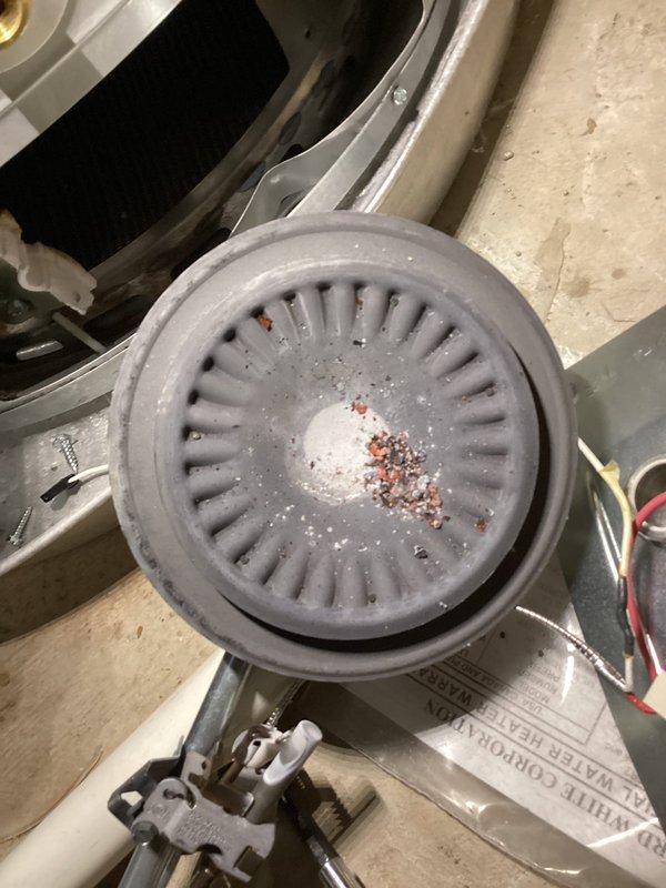 Responded to no hot water complaint on 8-year-old Bradford White water heater. Upon inspection, found unit completely inoperative with no hot water production. Performed diagnostic evaluation of heating elements, thermostat operation, and electrical connections. Removed and cleaned blower assembly which showed significant dust and debris accumulation affecting performance. Installed new drain pan with proper PVC drainage connections to ensure code compliance and prevent potential water damage. Tested all safety controls, verified proper electrical supply, and confirmed restoration of hot water delivery. Unit returned to full operational status.