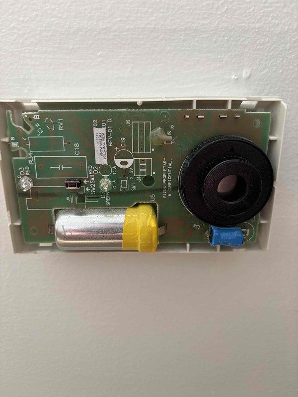 Responded to service call for furnace not heating with alarm sounding. Upon arrival, found carbon monoxide detector in alarm state displaying 000 ppm reading. Inspected Defender low-level CO monitor and internal circuit board components. Tested detector functionality using test/reset button and verified power supply and sensor operation. Determined alarm was triggered but CO levels returned to safe readings. Reset carbon monoxide detector and verified proper operation of all indicator lights and alarm functions. Advised on proper CO detector maintenance and monitoring procedures.