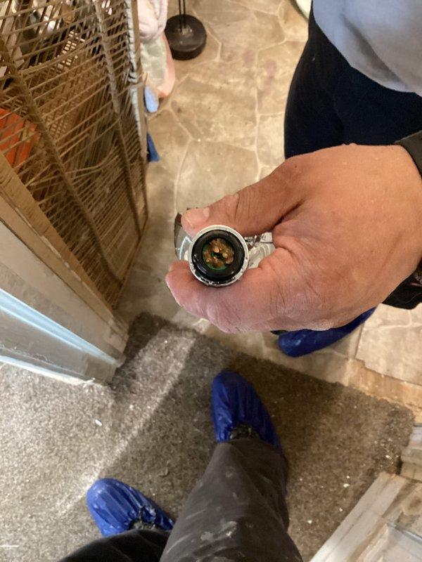 Responded to service call for no water flow from shower head following previous repair. Upon arrival, performed diagnostic testing of water pressure using calibration gauge to verify system pressure levels and identify source of flow restriction. Inspection revealed pressure irregularities requiring adjustment. Successfully restored proper water pressure and flow to shower head fixture. Verified complete restoration of water delivery through fixture testing. System now operating within normal parameters with full water flow restored.