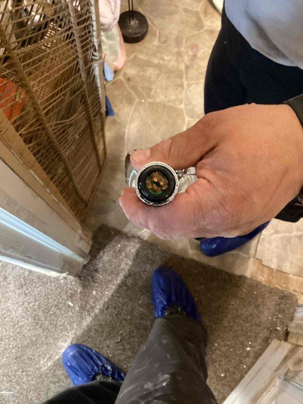 Responded to service call for no water flow from shower head following previous repair. Upon arrival, performed diagnostic testing of water pressure using calibration gauge to verify system pressure levels and identify source of flow restriction. Inspection revealed pressure irregularities requiring adjustment. Successfully restored proper water pressure and flow to shower head fixture. Verified complete restoration of water delivery through fixture testing. System now operating within normal parameters with full water flow restored.