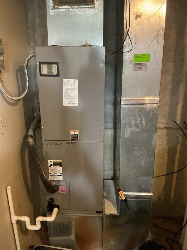 Responded to service call for 15-year-old heat pump system with dual complaints: no cooling in summer and no heating in winter, requiring emergency heat operation. Upon arrival, performed comprehensive diagnostic evaluation of air handler unit and associated components in basement mechanical room. Inspected electrical connections, refrigerant lines, condensate drainage system, and reversing valve operation. Found heat pump operating in emergency heat mode due to failed reversing valve preventing proper refrigerant flow direction changes between heating and cooling cycles. Verified compressor functionality and checked refrigerant charge levels. Identified additional concerns with outdoor unit communication to indoor air handler affecting defrost cycle and mode switching. Documented equipment condition with photographic evidence showing air handler installation, ductwork connections, and utility room setup. Provided customer with repair options and recommendations for restoring full heat