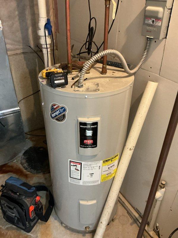Responded to service call for 15-year-old heat pump system with dual complaints: no cooling in summer and no heating in winter, requiring emergency heat operation. Upon arrival, performed comprehensive diagnostic evaluation of air handler unit and associated components in basement mechanical room. Inspected electrical connections, refrigerant lines, condensate drainage system, and reversing valve operation. Found heat pump operating in emergency heat mode due to failed reversing valve preventing proper refrigerant flow direction changes between heating and cooling cycles. Verified compressor functionality and checked refrigerant charge levels. Identified additional concerns with outdoor unit communication to indoor air handler affecting defrost cycle and mode switching. Documented equipment condition with photographic evidence showing air handler installation, ductwork connections, and utility room setup. Provided customer with repair options and recommendations for restoring full heat